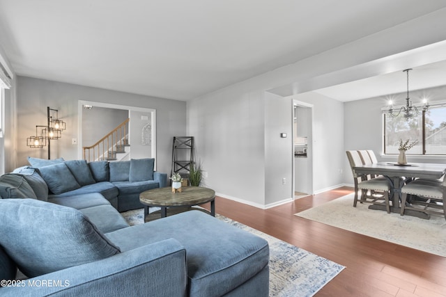 3 Mendon Dr, Howell, NJ 07731 - living room featuring a chandelier, dark wood-style floors, and stairs