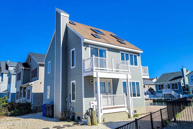 443 Harding Ave, Ortley Beach, NJ 08751 - rear view of property with a balcony, a chimney, and a residential view