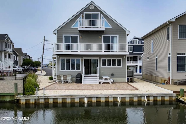 443 Harding Ave, Ortley Beach, NJ 08751 - rear view of house with a balcony, a water view, a patio, and entry steps