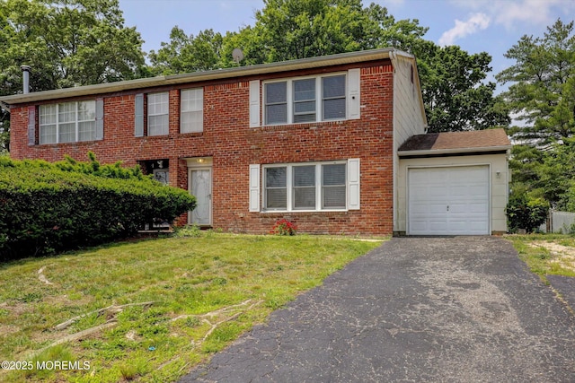 73 Barnegat Blvd S, Barnegat, NJ 08005 - colonial home featuring a garage, asphalt driveway, a front yard, and brick siding