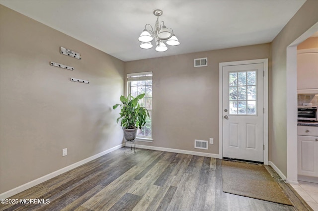 73 Barnegat Blvd S, Barnegat, NJ 08005 - entryway with a chandelier and light wood finished floors