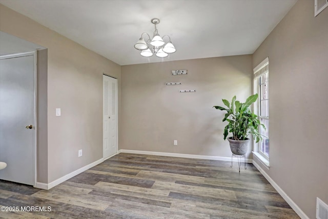 73 Barnegat Blvd S, Barnegat, NJ 08005 - unfurnished dining area with healthy amount of natural light, a chandelier, and wood finished floors
