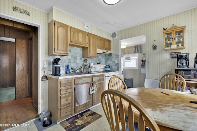 207 New York Ave, Bergenfield, NJ 07621 - kitchen with wallpapered walls, crown molding, gas range gas stove, light countertops, and under cabinet range hood