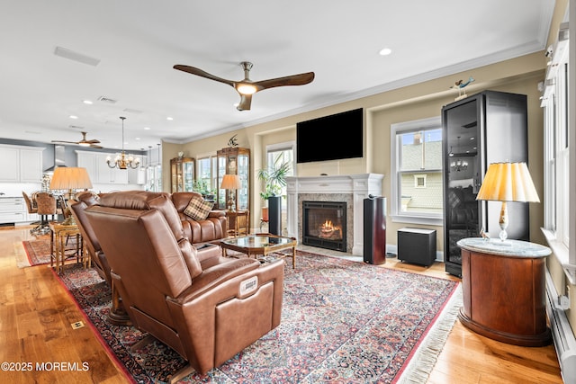 17 Atlantic Ave, Ocean Grove, NJ 07756 - living area featuring a ceiling fan, a fireplace with flush hearth, light wood-style floors, ornamental molding, and recessed lighting