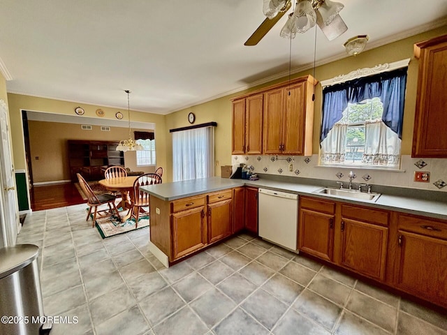 15 Hannah Lee Rd, Barnegat, NJ 08005 - kitchen with dishwasher, healthy amount of natural light, a peninsula, brown cabinetry, and ornamental molding