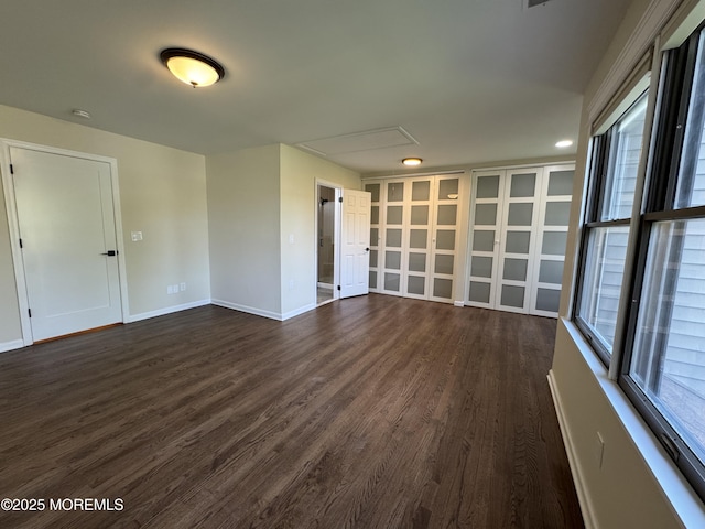 3 Churchill Downs, West Long Branch, NJ 07764 - spare room featuring dark wood-style floors and attic access