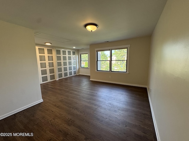 3 Churchill Downs, West Long Branch, NJ 07764 - spare room featuring baseboards and dark wood-style flooring
