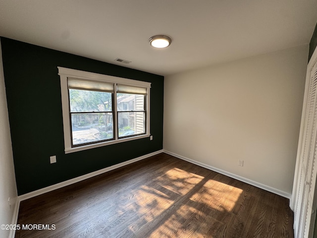 3 Churchill Downs, West Long Branch, NJ 07764 - spare room with dark wood-style flooring and baseboards