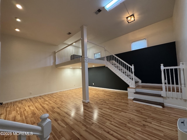3 Churchill Downs, West Long Branch, NJ 07764 - unfurnished living room featuring wood finished floors and stairway