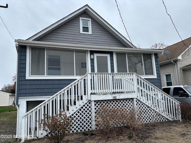530 E Point Pleasant Ave, Ocean Gate, NJ 08740 - view of front of home with a sunroom and stairway