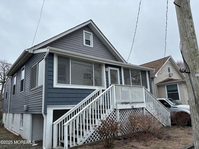 530 E Point Pleasant Ave, Ocean Gate, NJ 08740 - view of front of home featuring a sunroom and stairway