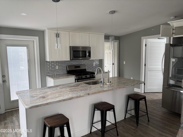 530 E Point Pleasant Ave, Ocean Gate, NJ 08740 - kitchen featuring stainless steel appliances, dark wood-type flooring, white cabinets, backsplash, and recessed lighting