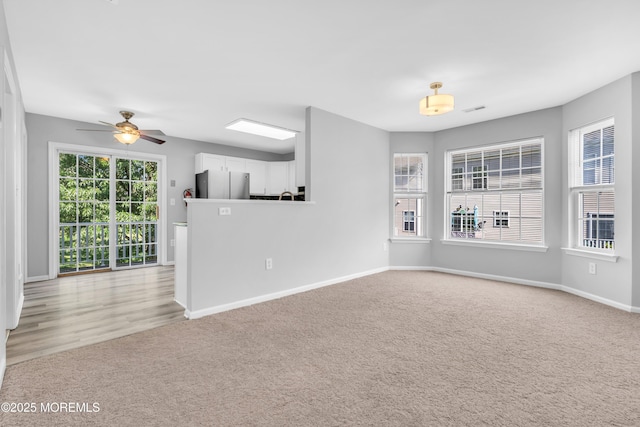 2211 Timber Ridge Ct Unit 2211, Sayreville, NJ 08859 - unfurnished living room with a ceiling fan and light carpet