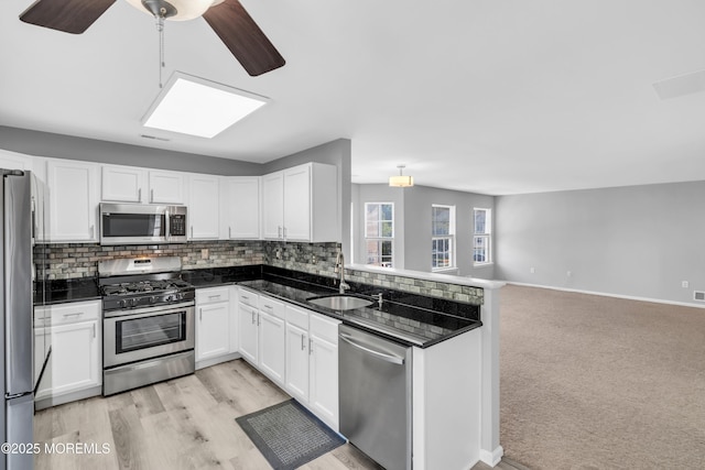 2211 Timber Ridge Ct Unit 2211, Sayreville, NJ 08859 - kitchen featuring stainless steel appliances, white cabinetry, and tasteful backsplash