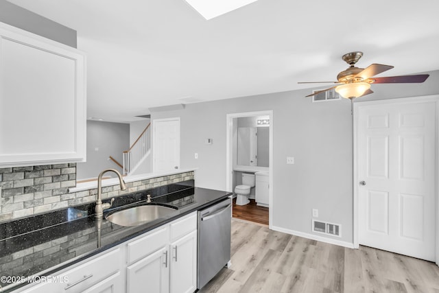 2211 Timber Ridge Ct Unit 2211, Sayreville, NJ 08859 - kitchen featuring dishwasher, a ceiling fan, white cabinets, tasteful backsplash, and light wood finished floors