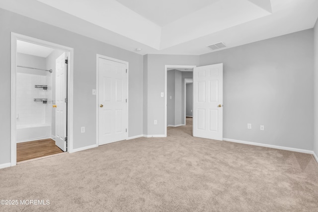 2211 Timber Ridge Ct Unit 2211, Sayreville, NJ 08859 - unfurnished bedroom with carpet floors, a raised ceiling, and ensuite bath