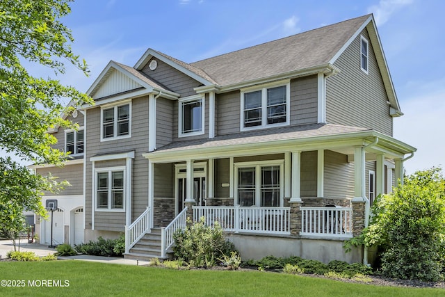 1605 Lakewood Rd, Manasquan, NJ 08736 - view of front facade featuring covered porch, a garage, stone siding, and a shingled roof