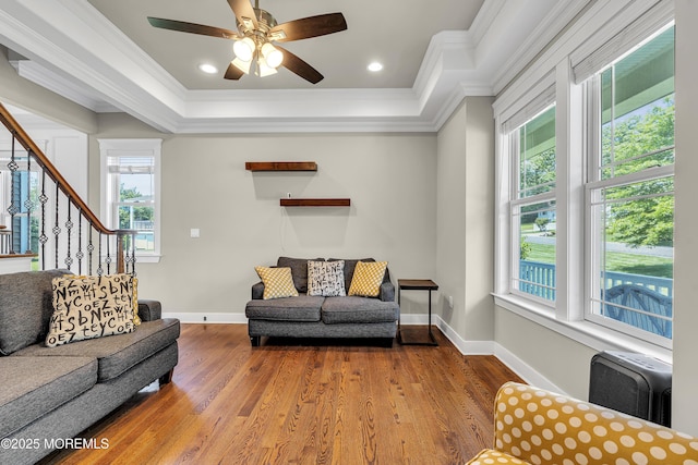 1605 Lakewood Rd, Manasquan, NJ 08736 - living area featuring ornamental molding, stairway, wood finished floors, ceiling fan, and a tray ceiling