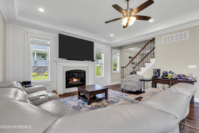 1605 Lakewood Rd, Manasquan, NJ 08736 - living area with ornamental molding, dark wood finished floors, a tray ceiling, stairway, and a ceiling fan