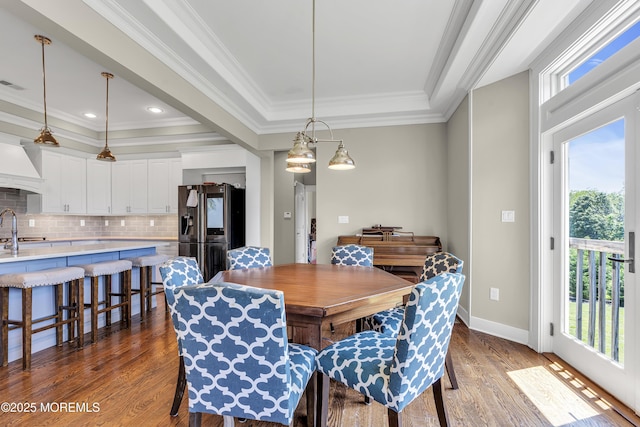 1605 Lakewood Rd, Manasquan, NJ 08736 - dining room featuring a tray ceiling, crown molding, and dark wood-style floors