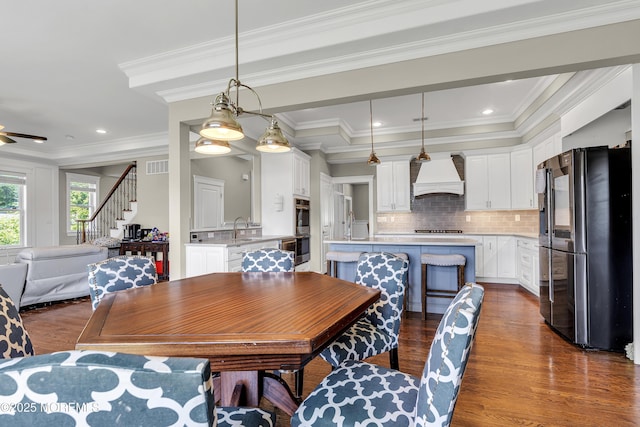 1605 Lakewood Rd, Manasquan, NJ 08736 - dining room featuring dark wood-style floors, stairway, and crown molding