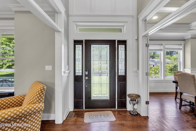1605 Lakewood Rd, Manasquan, NJ 08736 - entryway with ornamental molding, dark wood finished floors, healthy amount of natural light, a decorative wall, and a wainscoted wall