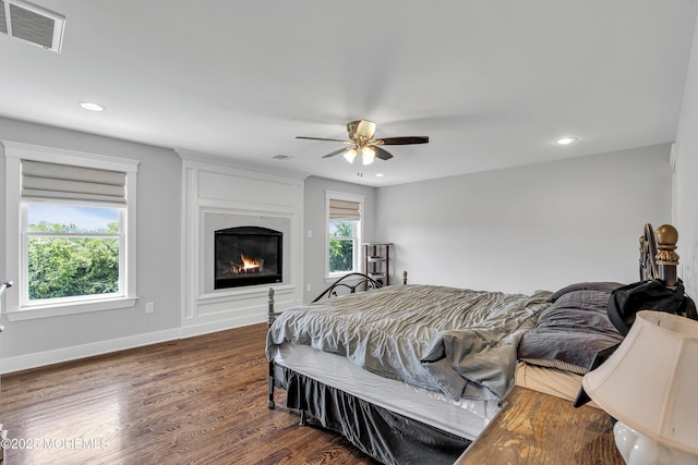 1605 Lakewood Rd, Manasquan, NJ 08736 - bedroom featuring recessed lighting, dark wood-style floors, a glass covered fireplace, and a ceiling fan