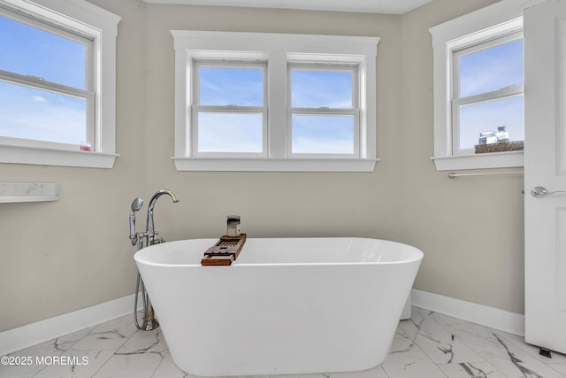 1605 Lakewood Rd, Manasquan, NJ 08736 - full bath with marble finish flooring, plenty of natural light, and a freestanding bath