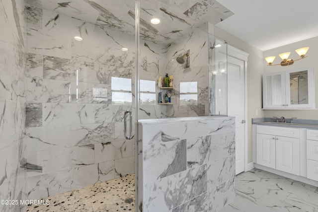 1605 Lakewood Rd, Manasquan, NJ 08736 - bathroom featuring a marble finish shower, vanity, a chandelier, and marble look tile flooring