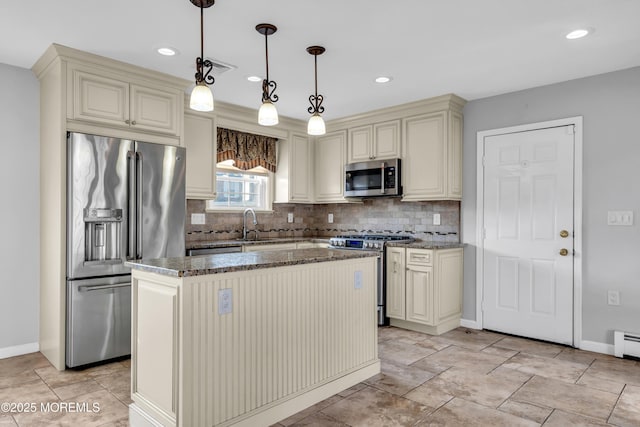 91 Wind Jammer Ct, Bayville, NJ 08721 - kitchen with cream cabinets, stainless steel appliances, dark stone counters, decorative backsplash, and recessed lighting