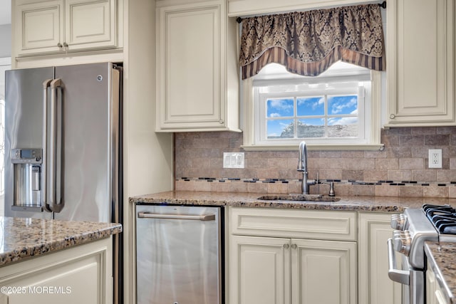 91 Wind Jammer Ct, Bayville, NJ 08721 - kitchen with appliances with stainless steel finishes, tasteful backsplash, cream cabinets, and light stone countertops