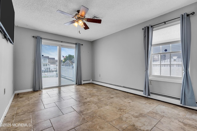 91 Wind Jammer Ct, Bayville, NJ 08721 - spare room with a textured ceiling, a ceiling fan, a baseboard radiator, and stone finish floors