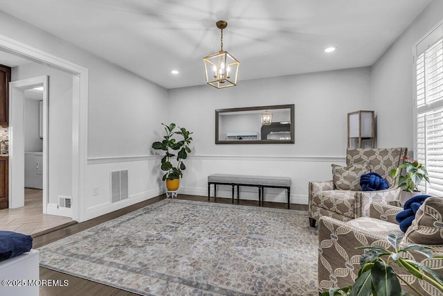 32 Blackbriar Dr, Colts Neck, NJ 07722 - living area featuring a chandelier, healthy amount of natural light, wood finished floors, and recessed lighting