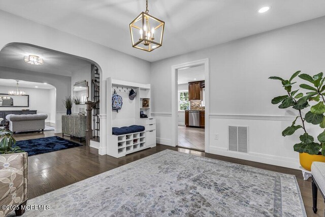 32 Blackbriar Dr, Colts Neck, NJ 07722 - foyer entrance with a chandelier, arched walkways, wood finished floors, and recessed lighting