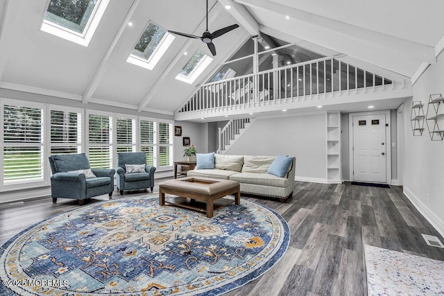 32 Blackbriar Dr, Colts Neck, NJ 07722 - living room with high vaulted ceiling, beamed ceiling, dark wood-style flooring, a skylight, and ceiling fan