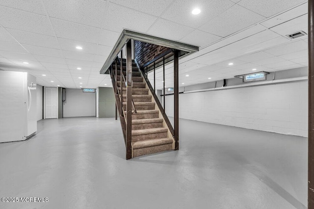 32 Blackbriar Dr, Colts Neck, NJ 07722 - finished basement with freestanding refrigerator, stairs, recessed lighting, and a drop ceiling