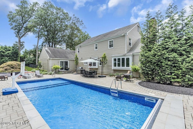 32 Blackbriar Dr, Colts Neck, NJ 07722 - outdoor pool with a patio and outdoor dining area