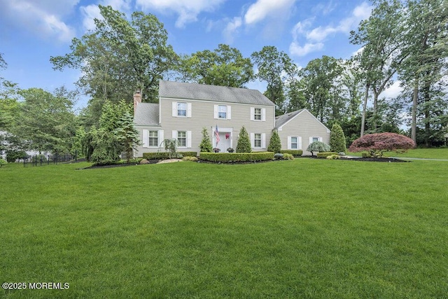 32 Blackbriar Dr, Colts Neck, NJ 07722 - colonial-style house featuring a front lawn and a chimney