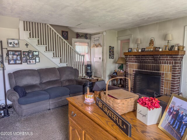 192 Bath Ave, Long Branch, NJ 07740 - living room with a textured ceiling, stairway, and a brick fireplace