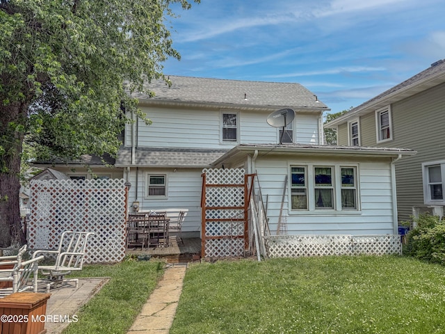 192 Bath Ave, Long Branch, NJ 07740 - back of house featuring a lawn, a patio, and roof with shingles