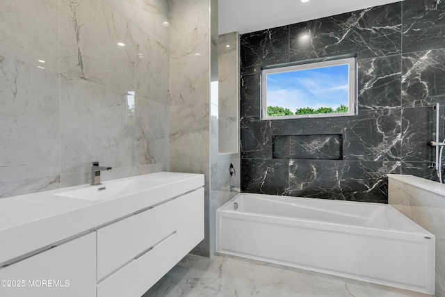 1423 Anthony Ct, Toms River, NJ 08753 - bathroom with tile walls, a garden tub, marble tiled floors, and vanity