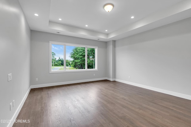 1423 Anthony Ct, Toms River, NJ 08753 - unfurnished room featuring dark wood-style flooring, a raised ceiling, and recessed lighting
