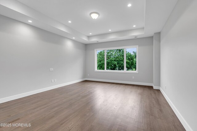 1423 Anthony Ct, Toms River, NJ 08753 - unfurnished room with dark wood-style floors, recessed lighting, and a raised ceiling