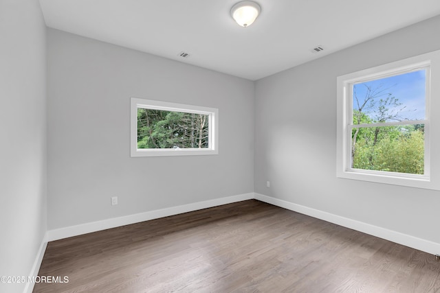 1423 Anthony Ct, Toms River, NJ 08753 - unfurnished room with baseboards and wood finished floors