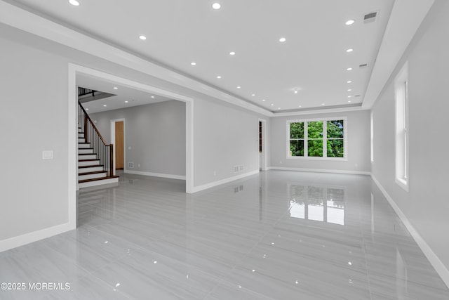 1423 Anthony Ct, Toms River, NJ 08753 - empty room with stairway, a tray ceiling, recessed lighting, and light tile patterned floors