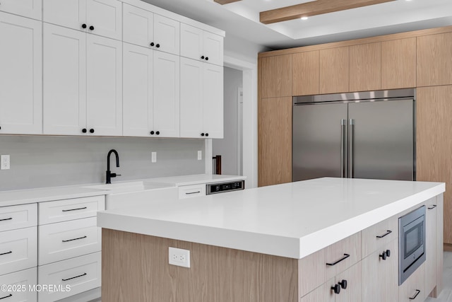 1423 Anthony Ct, Toms River, NJ 08753 - kitchen with appliances with stainless steel finishes, light countertops, a center island, and white cabinets