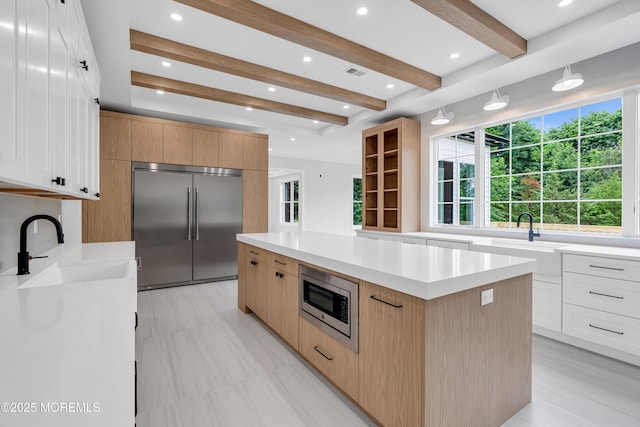 1423 Anthony Ct, Toms River, NJ 08753 - kitchen with built in appliances, a kitchen island, light countertops, beamed ceiling, and recessed lighting