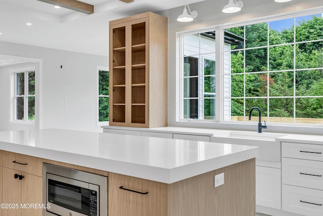 1423 Anthony Ct, Toms River, NJ 08753 - kitchen with stainless steel microwave, light countertops, light brown cabinetry, recessed lighting, and beamed ceiling