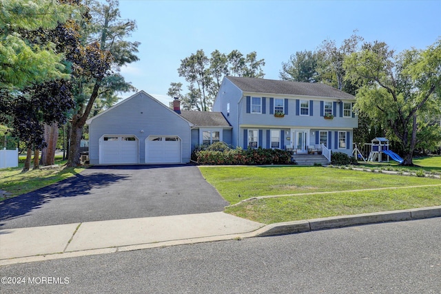 12 Harbor Ct, West Long Branch, NJ 07764 - colonial-style house featuring asphalt driveway, an attached garage, and a front yard