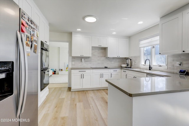 12 Harbor Ct, West Long Branch, NJ 07764 - kitchen featuring stainless steel refrigerator with ice dispenser, light wood-type flooring, tasteful backsplash, white cabinetry, and recessed lighting